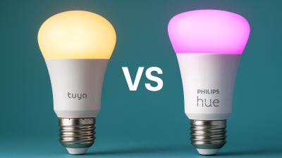 Comparison of Tuya and Philips Hue smart light bulbs side-by-side on colored background